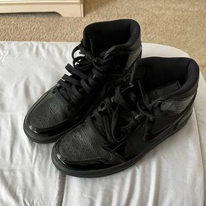 Women’s all black Jordan 1s